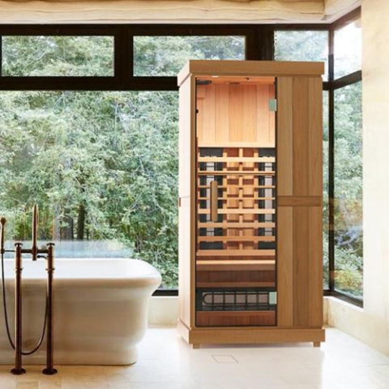 Finnmark Compact 1 Person Full-Spectrum Infrared Sauna - displayed beside a bathtub
