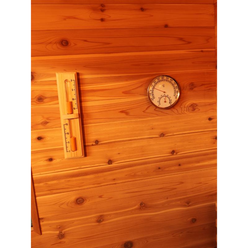 SunRay Seneca HL300DS Home Steam Sauna - close up of the hygrometer and the thermometer on the wall.