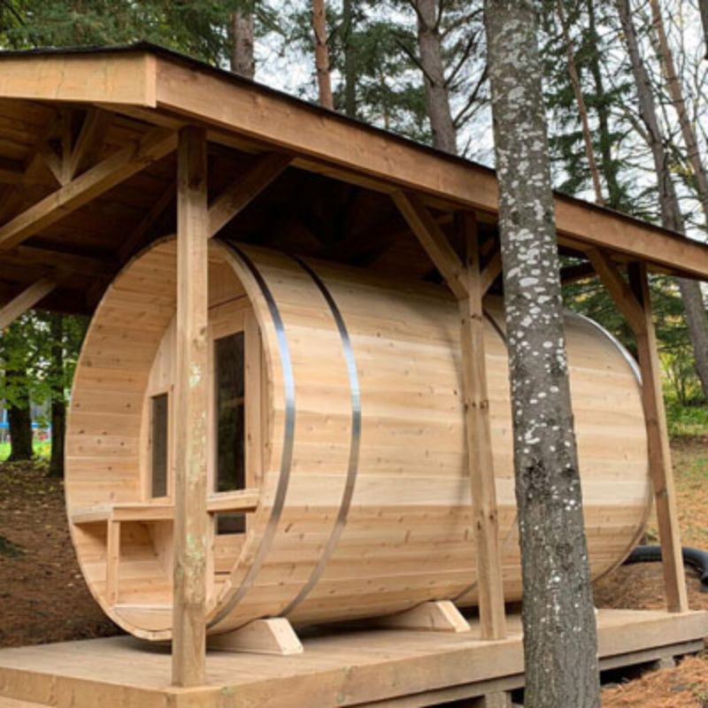 Dundalk LeisureCraft Tranquility Barrel Sauna CTC2345H - angled view, sauna under shelter