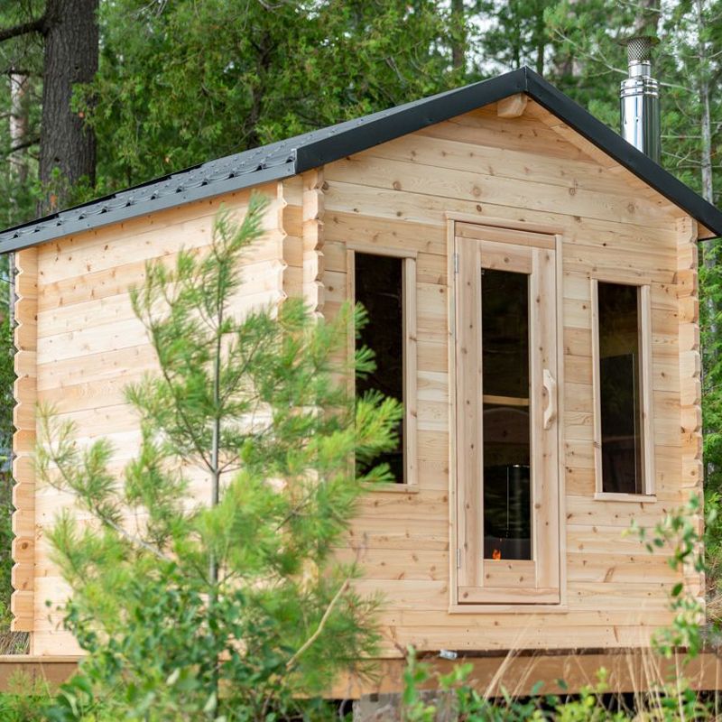 Dundalk LeisureCraft Georgian Outdoor 6 Person Steam Sauna - front angle with trees