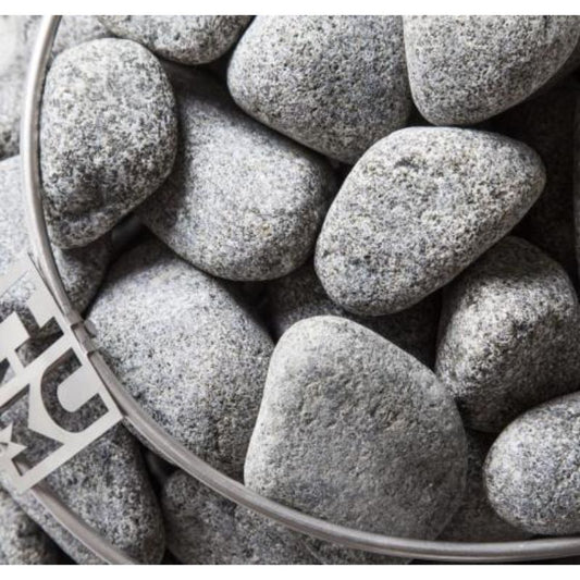 Round Olivine sauna stones - very close up in a sauna heater