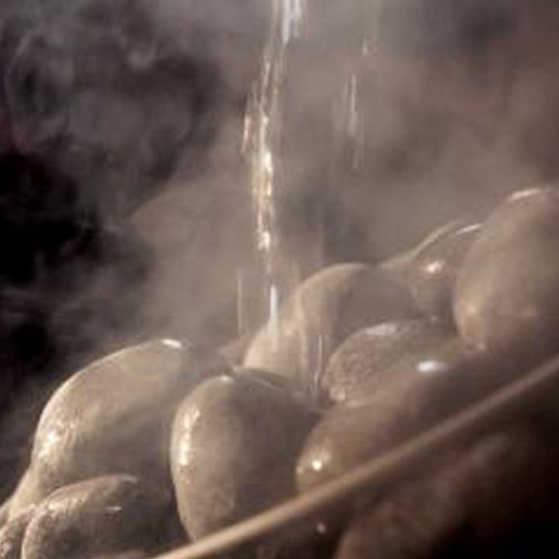 Round Olivine sauna stones - water poured on rocks