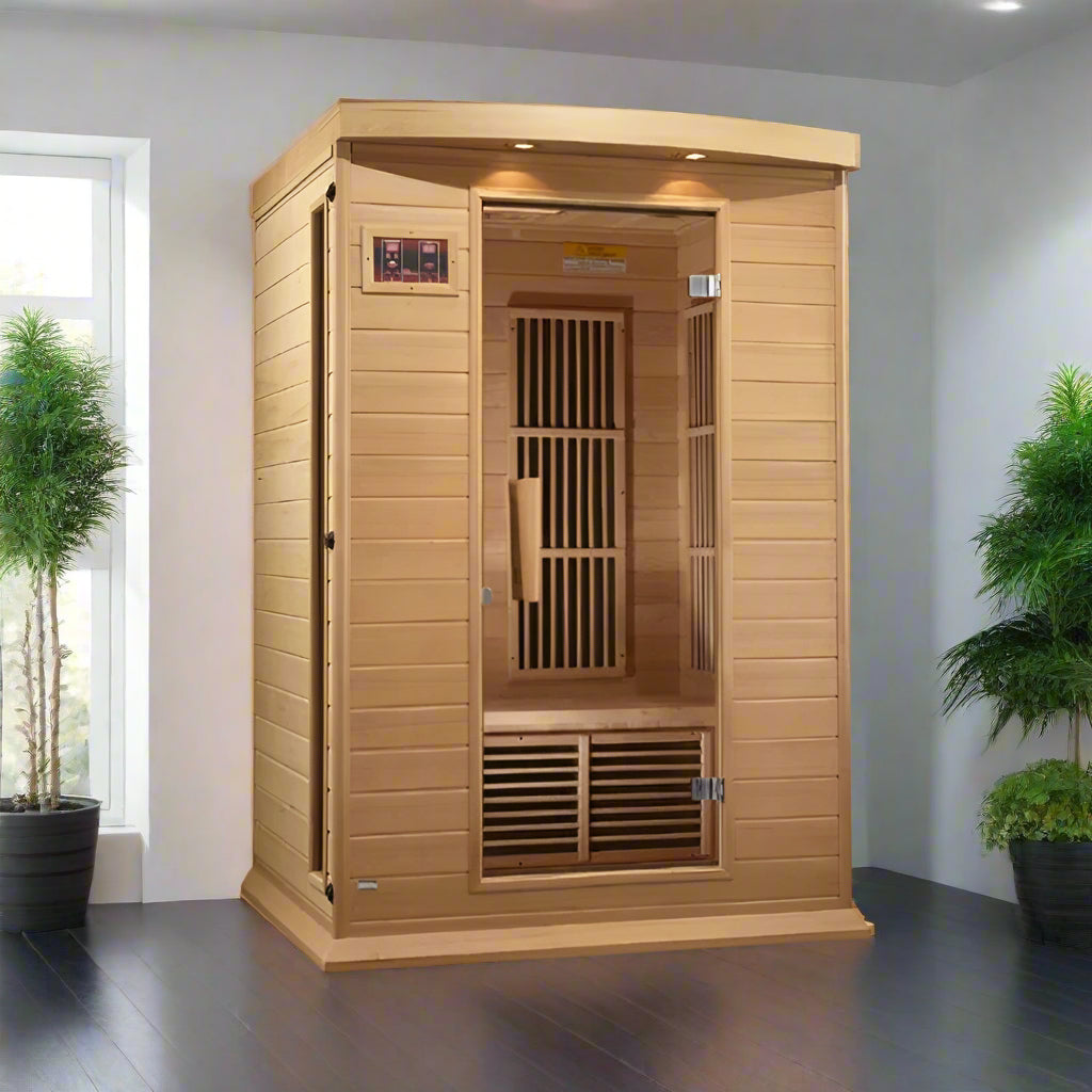 Maxxus MX-K206-01 Far Infrared Sauna - full view in a sunny room with a window on the left and plants flanking both sides