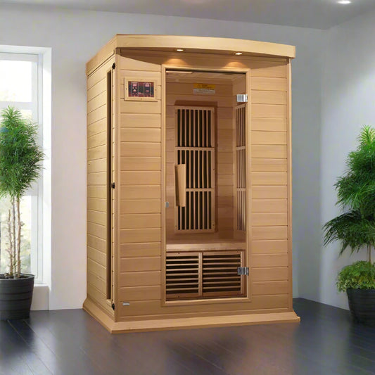 Maxxus MX-K206-01 Far Infrared Sauna - full view in a sunny room with a window on the left and plants flanking both sides