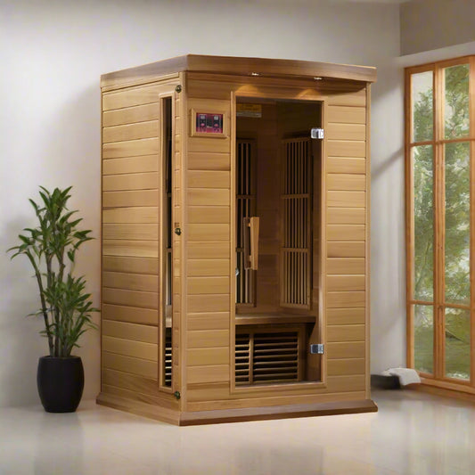 Maxxus Cedar Infrared Sauna MX-K206-01 - full angled view, in a room with a window and a plant on the left.