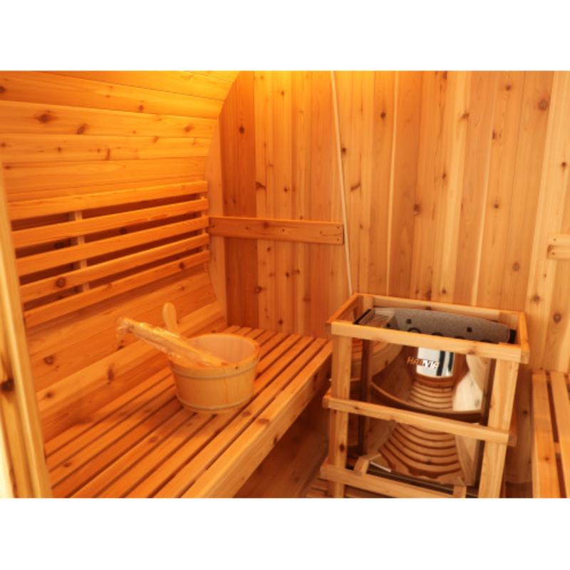 Aurora traditional barrel sauna - view of the other curved wall with bench and bucket on the bench