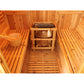 Aurora traditional barrel sauna - heater between benches and bucket on the bench