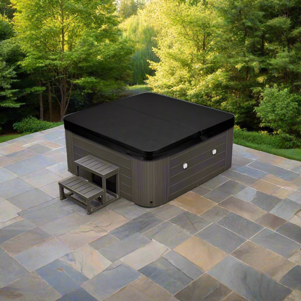 Estes 5 Person Hot Tub - full view of the tub on a stone patio with trees in the background