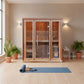 Hampton 300TN Traditional 3 person Sauna in a room with a large window on the left and a yoga mat in front