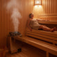 Harvia sauna heater beside a bench with a person in a towel