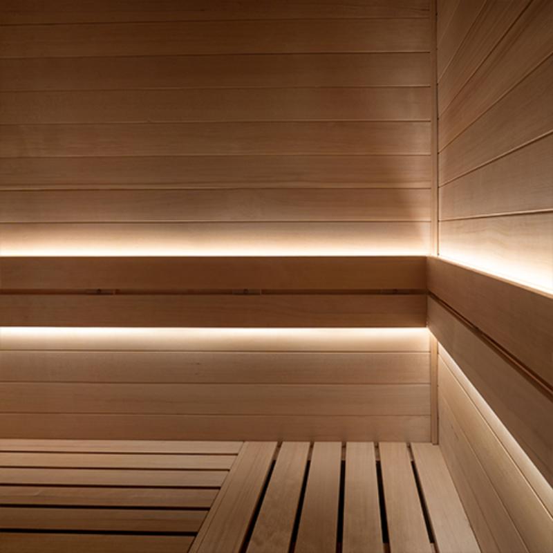 Single zone lighting kit - sauna interior showing bench backs with the light strips installed behind them