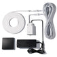 A wired control or sensor kit laid out on a white background, including a coiled white cable, a white junction/control box, a black rectangular sensor or switch, and a black power adapter.