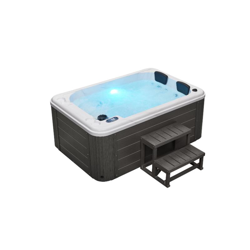 Riley 3 Person Hot Tub - full view, with water and steps beside it