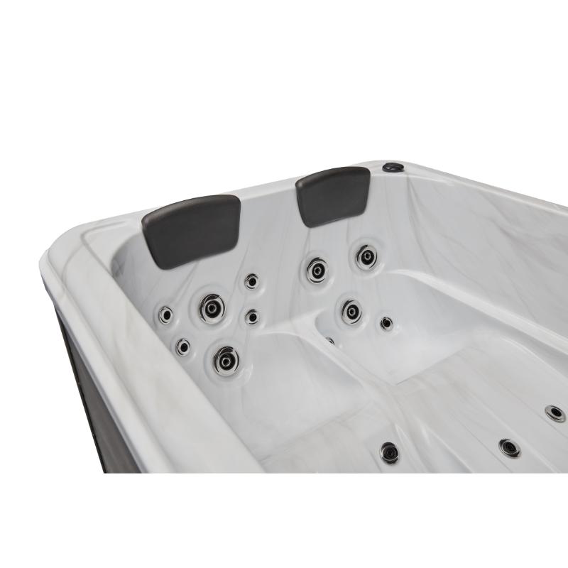 Riley 3 Person Hot Tub - interior of tub close up, no water. Showing headrests and jets.