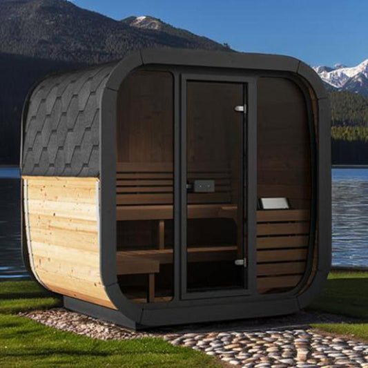 Sauna Life CL5G Home Cube Sauna - full angled view of the front. Sauna is on a rock patio with lake, mountains and blue sky behind.