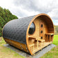 Sauna Life G11 Dome Outdoor Home Sauna - exterior angled view showing the shingled roof from the side, trees and cloudy sky in the background