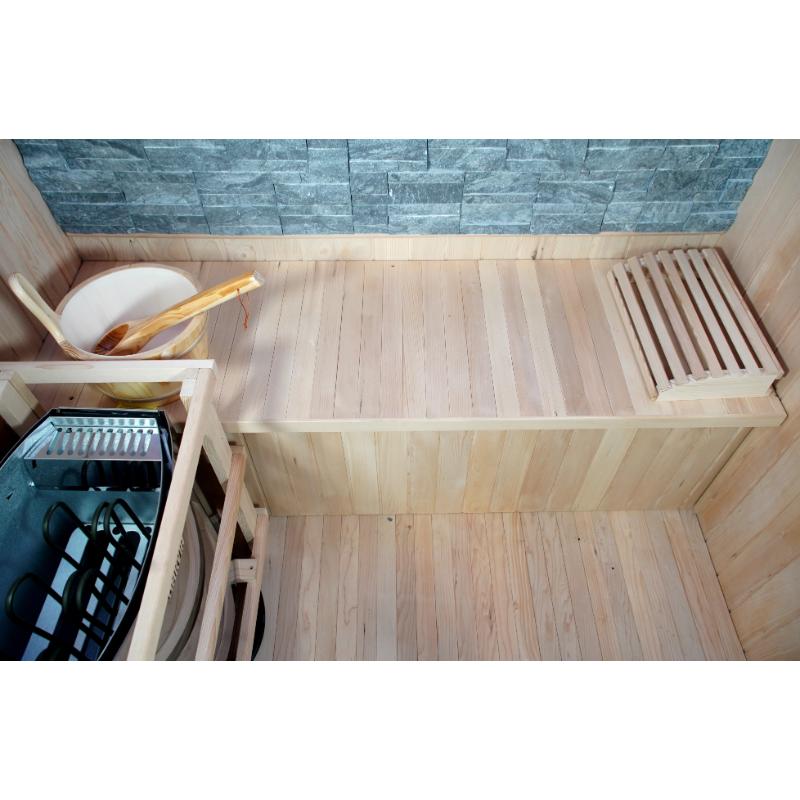 Westlake 3 Person Traditional Sauna - interior downward view of bench with Harvia heater on the left, as well as water bucket. On he right side of the bench is a backrest.