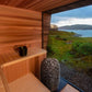 HUUM 9 kW Sauna Heater -HIVE Mini Series - inside sauna, in front of window with a big view