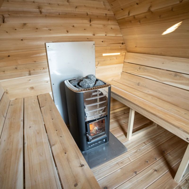 Dundalk MiniPOD 4 Person Outdoor Traditional Steam Sauna CTC77MW - wood-burning stove installed between benches